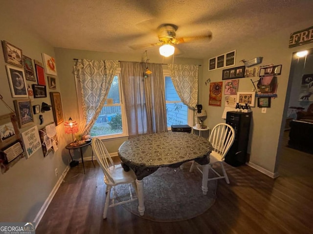 dining space with dark hardwood / wood-style floors, ceiling fan, and a textured ceiling