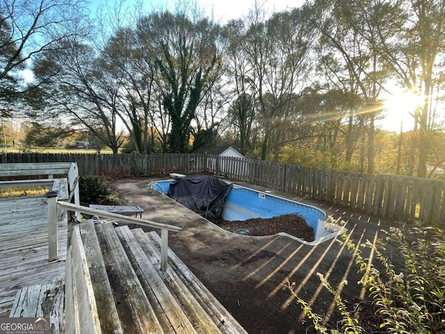 view of pool featuring a wooden deck