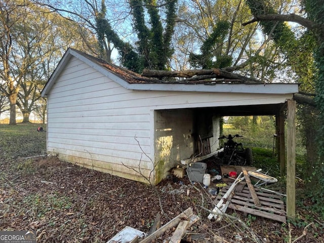 view of home's exterior with an outdoor structure