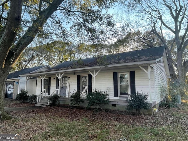 ranch-style house with cooling unit