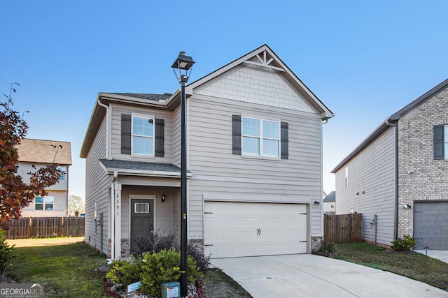 view of front of house featuring a garage and a front lawn