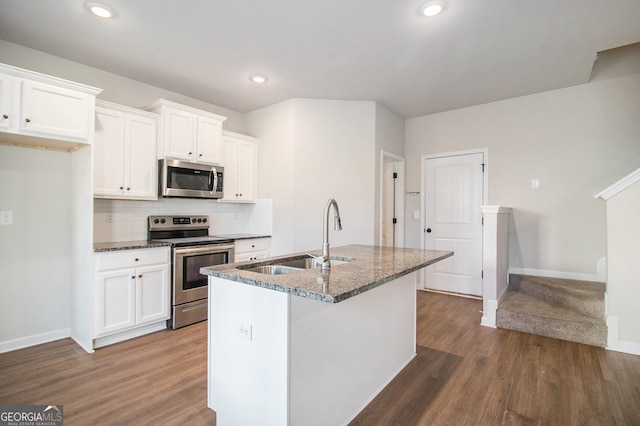 kitchen with white cabinets, stainless steel appliances, dark wood-type flooring, and sink