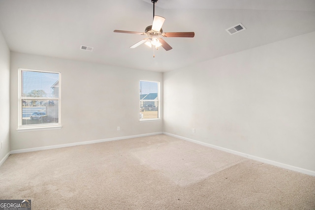 empty room featuring carpet flooring and ceiling fan