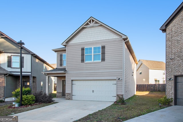 view of front of home with a front yard and a garage