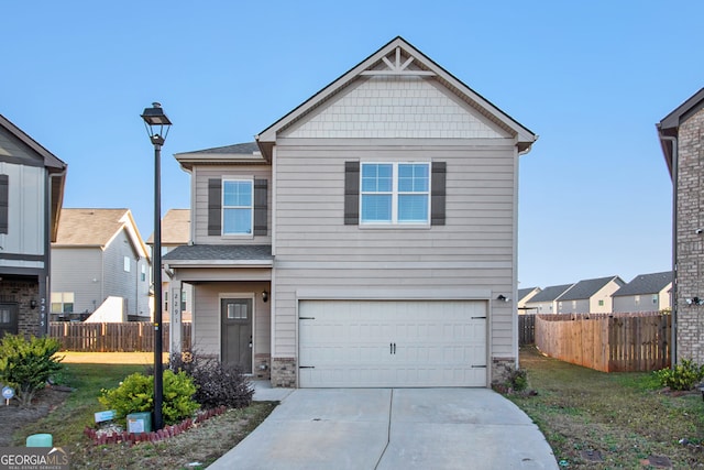 craftsman house with a front yard and a garage