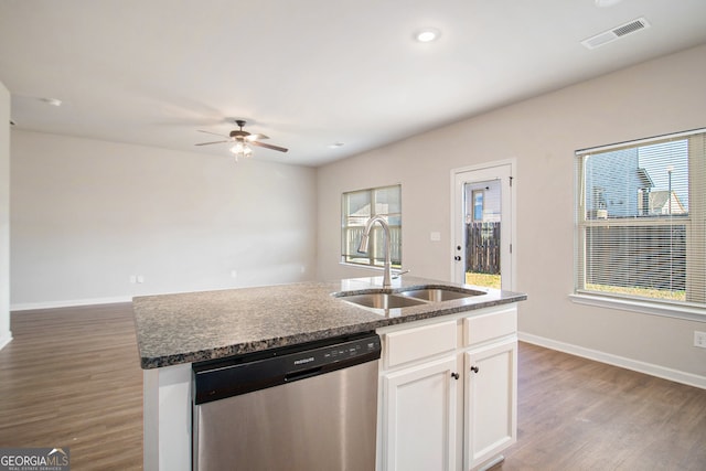 kitchen with a healthy amount of sunlight, white cabinetry, sink, and stainless steel dishwasher