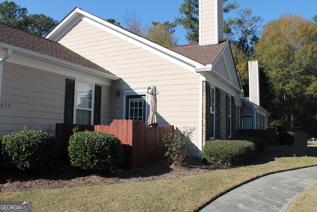 view of property exterior featuring a yard