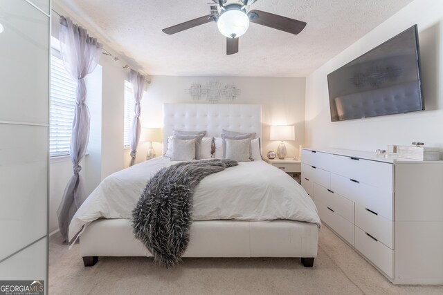 111 Swanton Hill Ct, Decatur, GA 30030 - bedroom featuring light carpet, a textured ceiling, and ceiling fan