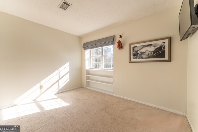 111 Swanton Hill Ct, Decatur, GA 30030 - empty room featuring visible vents, baseboards, carpet, and a textured ceiling