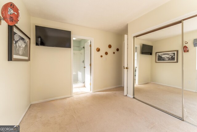 111 Swanton Hill Ct, Decatur, GA 30030 - unfurnished bedroom with ensuite bath, baseboards, a closet, and carpet floors