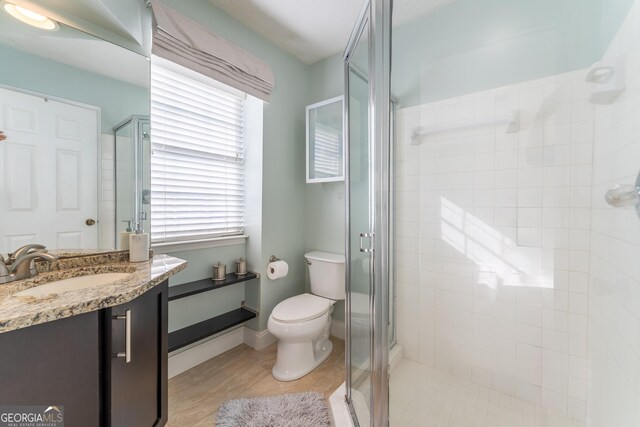 111 Swanton Hill Ct, Decatur, GA 30030 - bathroom featuring vanity, a shower stall, toilet, and baseboards
