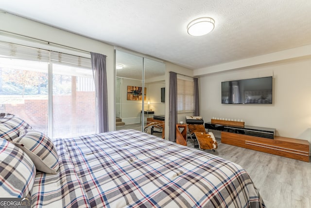 111 Swanton Hill Ct, Decatur, GA 30030 - bedroom with a textured ceiling and wood finished floors