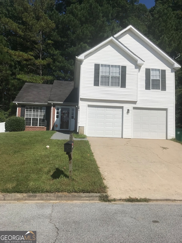 front of property featuring a garage and a front yard