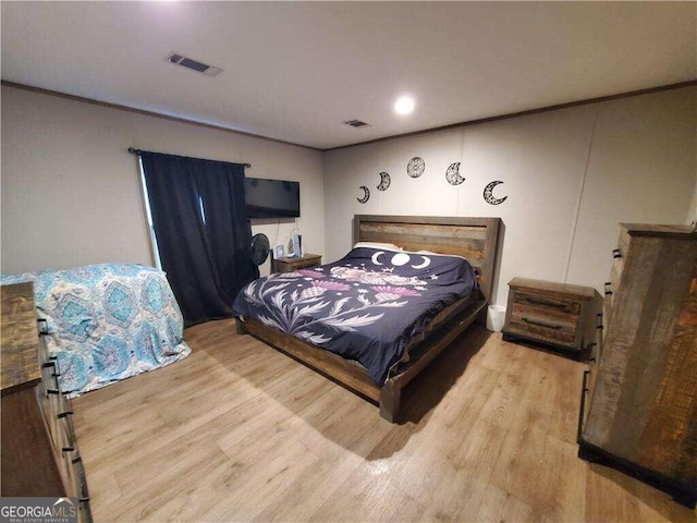 bedroom with light hardwood / wood-style floors