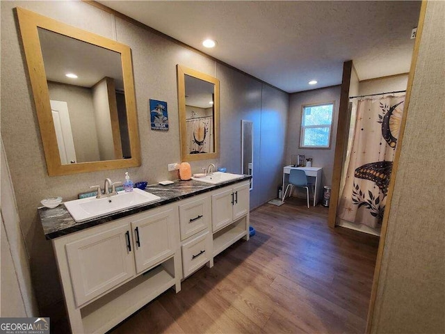 bathroom with hardwood / wood-style floors and vanity