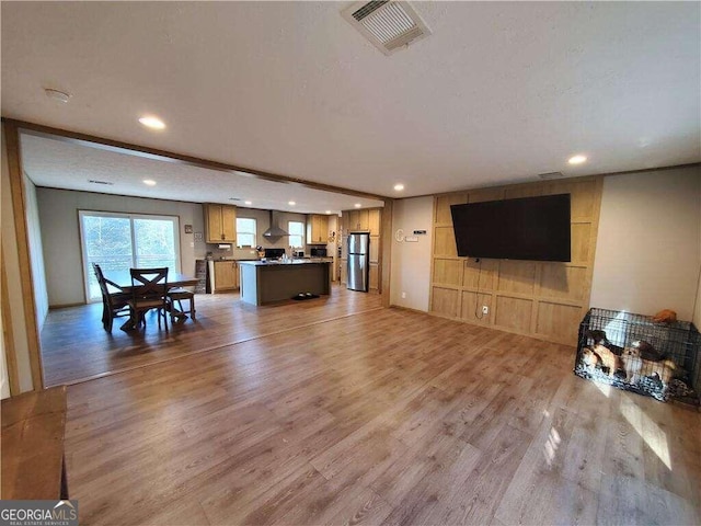 living room featuring hardwood / wood-style flooring and a textured ceiling