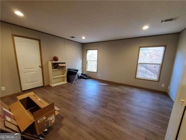 unfurnished living room with dark wood-type flooring