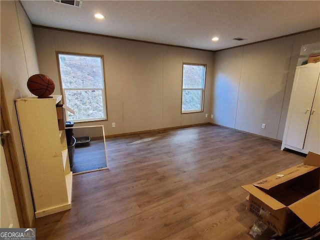 empty room featuring hardwood / wood-style floors and a healthy amount of sunlight