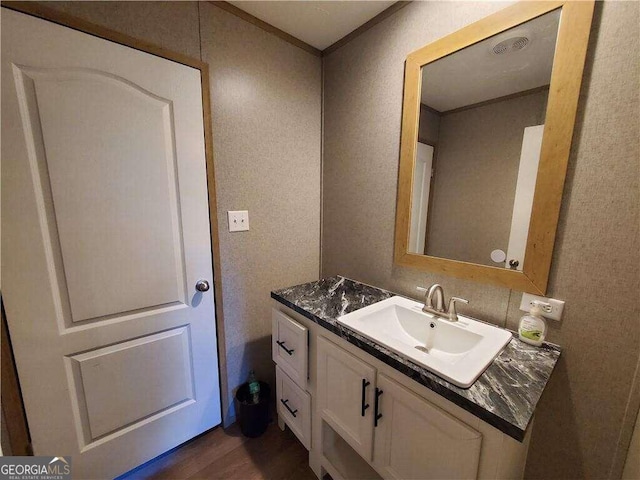 bathroom featuring hardwood / wood-style floors and vanity