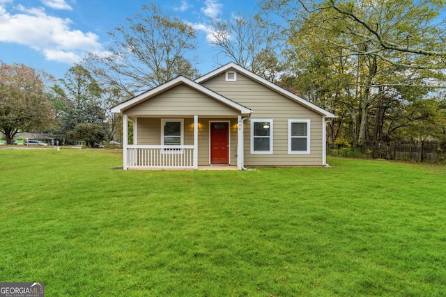 bungalow-style home with a front lawn and a porch