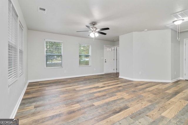 interior space with dark hardwood / wood-style floors and ceiling fan