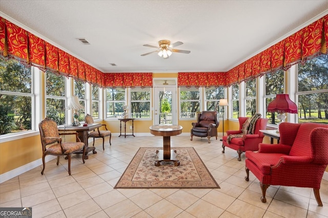 sunroom with ceiling fan