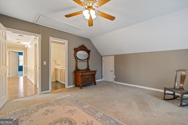 additional living space with light colored carpet, vaulted ceiling, and ceiling fan