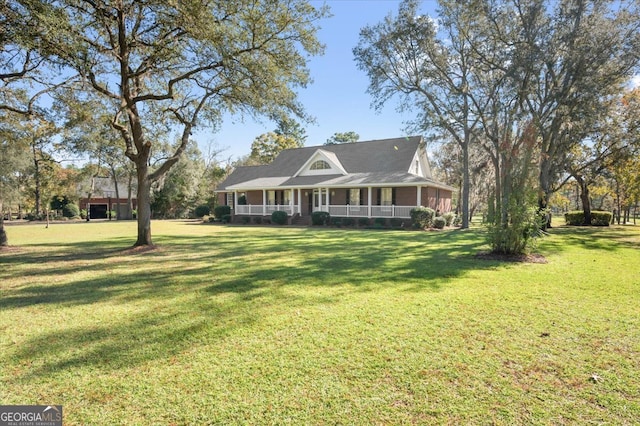 farmhouse inspired home with a porch and a front lawn