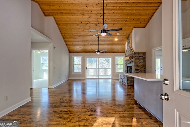 4502 Ramsay Dr, Hiawassee, GA 30546 - unfurnished living room featuring ceiling fan, wood ceiling, high vaulted ceiling, a stone fireplace, and wood finished floors