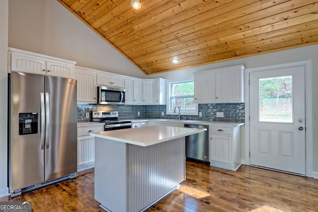 4502 Ramsay Dr, Hiawassee, GA 30546 - kitchen with appliances with stainless steel finishes, wooden ceiling, vaulted ceiling, white cabinets, and wood finished floors