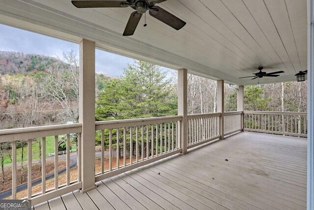 unfurnished living room featuring a stone fireplace, wooden ceiling, wood-type flooring, and high vaulted ceiling