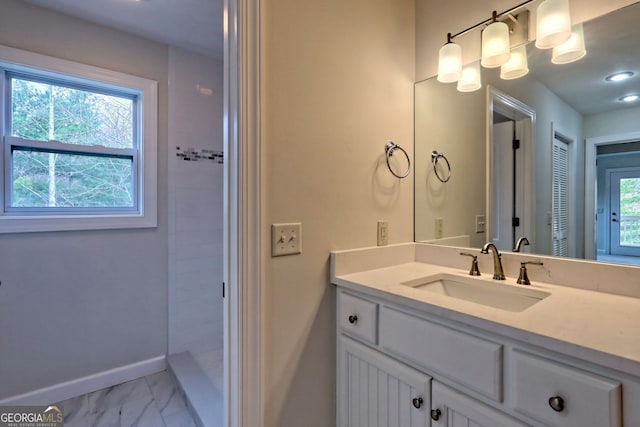 bathroom with plenty of natural light and vanity