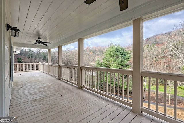 4502 Ramsay Dr, Hiawassee, GA 30546 - wooden terrace featuring a ceiling fan and a forest view