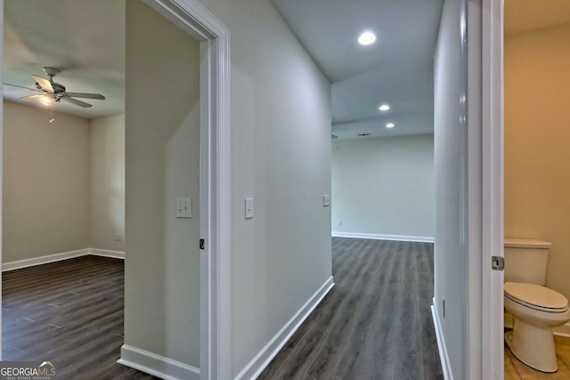 hallway featuring dark wood-type flooring