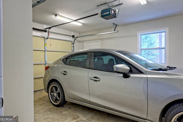 4502 Ramsay Dr, Hiawassee, GA 30546 - garage featuring a garage door opener