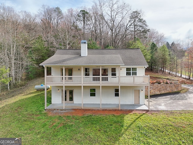 4502 Ramsay Dr, Hiawassee, GA 30546 - rear view of property with a patio, a yard, a chimney, and a shingled roof