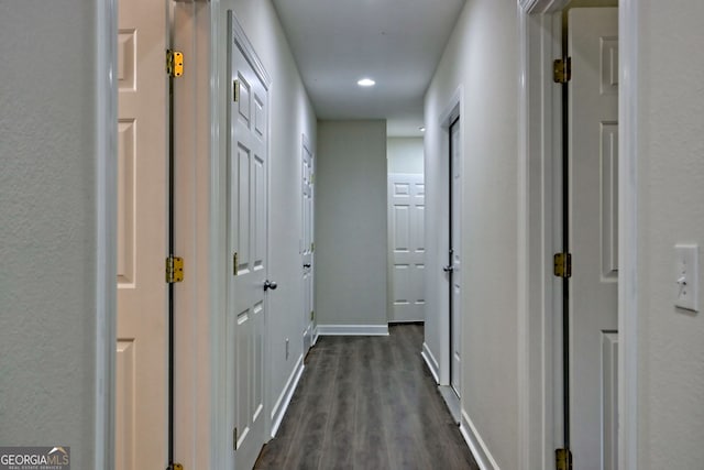 hallway with dark wood-type flooring