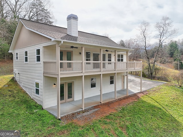 4502 Ramsay Dr, Hiawassee, GA 30546 - back of property with a patio area, ceiling fan, a lawn, a chimney, and roof with shingles