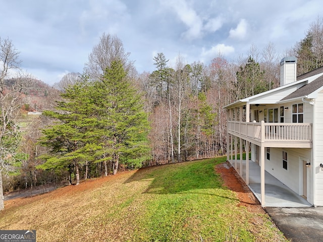4502 Ramsay Dr, Hiawassee, GA 30546 - view of green lawn featuring a balcony and a view of trees
