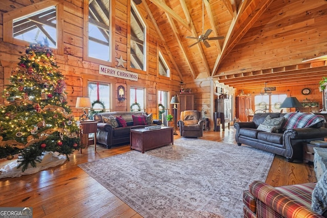 living room with wood walls and a wealth of natural light