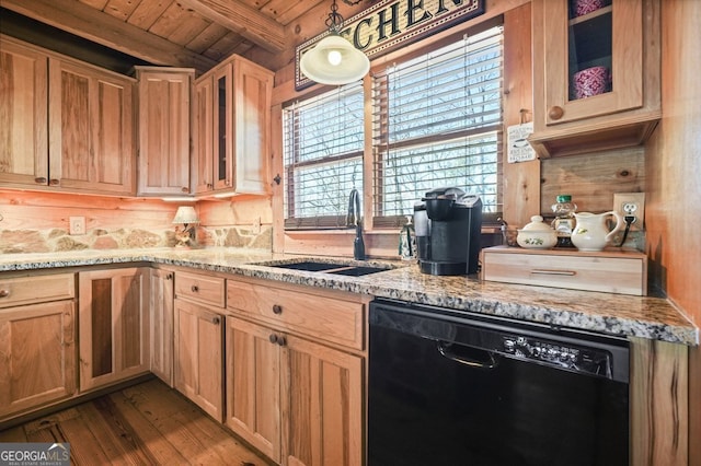 kitchen with light stone counters, black dishwasher, glass insert cabinets, wood ceiling, and a sink