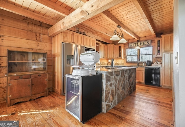 kitchen featuring stone counters, light wood-type flooring, dishwasher, brown cabinetry, and glass insert cabinets