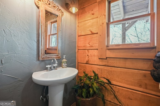 bathroom with a textured wall