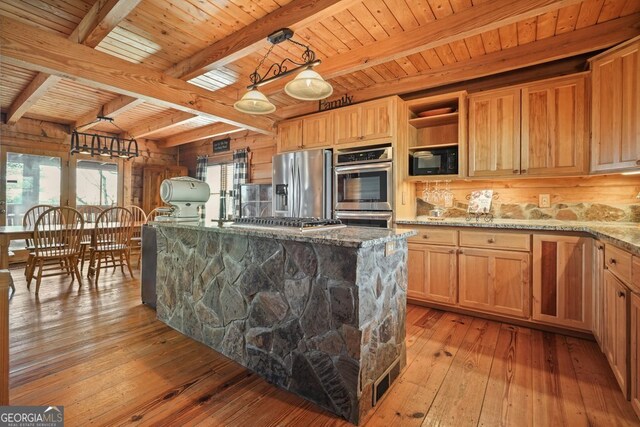 bedroom featuring beam ceiling, hardwood / wood-style flooring, ceiling fan, and wooden ceiling