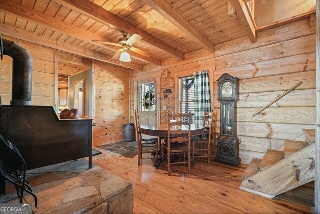 bathroom with hardwood / wood-style floors, vaulted ceiling with beams, wood walls, and wooden ceiling