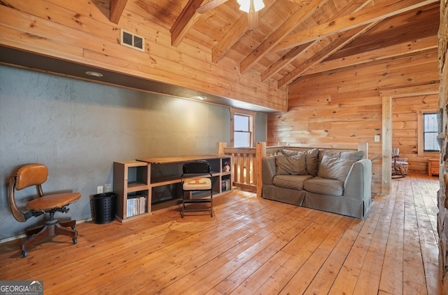 living room with high vaulted ceiling, wooden ceiling, visible vents, light wood finished floors, and beamed ceiling