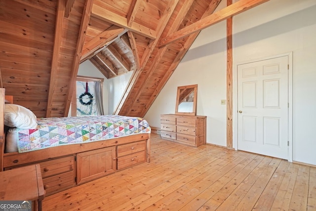 bedroom with wooden ceiling, vaulted ceiling with beams, and light wood finished floors