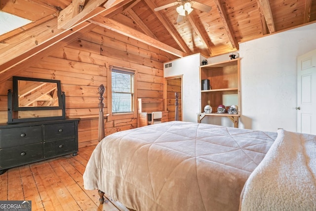 bedroom featuring light wood finished floors, visible vents, lofted ceiling with beams, wood ceiling, and wood walls