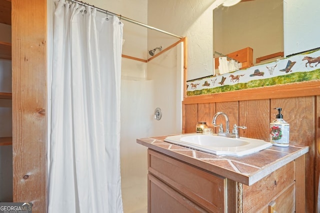 bathroom featuring vanity and walk in shower