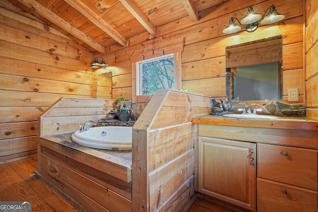 bathroom featuring lofted ceiling with beams, wood ceiling, wood finished floors, vanity, and wood walls